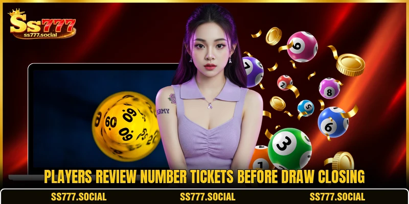 Players review number tickets before draw closing Players review number tickets before draw closing